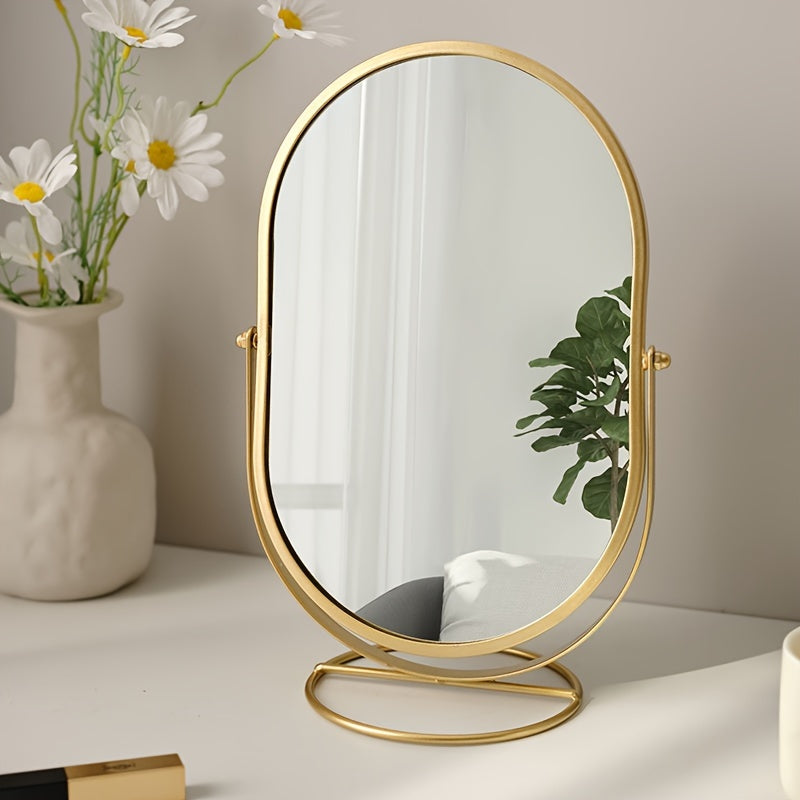Specchio da tavolo ovale con cornice dorata, riflesso di piante e interni moderni, decorazione elegante per casa, design minimalista.