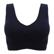 Reggiseno sportivo nero senza cuciture, design confortevole e supporto ottimale, ideale per attività fisica e uso quotidiano.