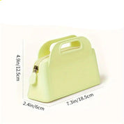 Borsetta gialla in silicone, dimensioni 18,5x6x12,5 cm, con chiusura a zip. Design moderno, ideale per accessori moda e uso quotidiano.