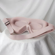 Maschera per dormire in seta rosa, design ergonomico, cinturino regolabile, ideale per bloccare la luce, migliorare il sonno e il relax.