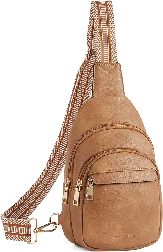 Zaino monospalla in pelle marrone con cerniere dorate e tracolla regolabile a righe. Design elegante e pratico per uso quotidiano.