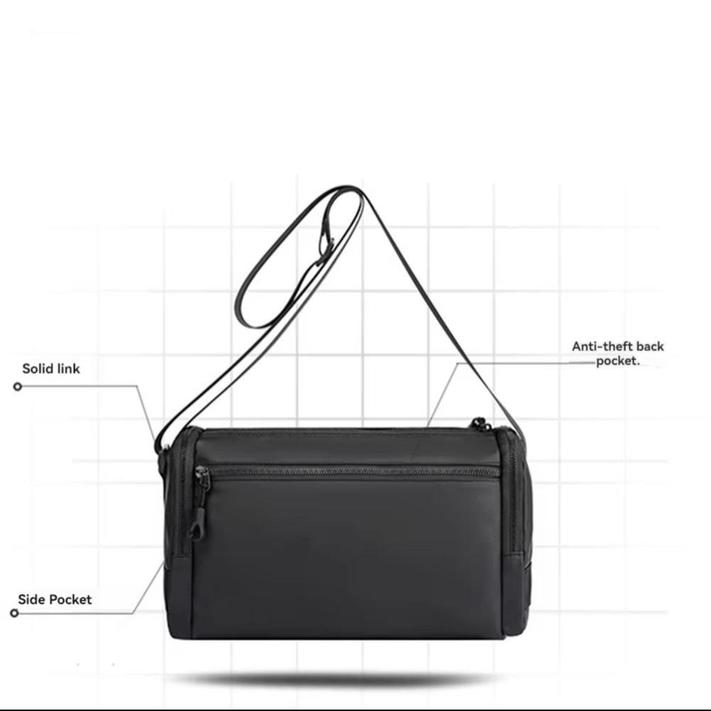 Borsa a tracolla nera unisex con tasca posteriore antifurto, tasca laterale e tracolla regolabile. Design moderno e funzionale per viaggi e lavoro.