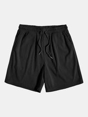 Pantaloncini neri a coste da uomo con elastico in vita e laccetti, tasche laterali. Abbigliamento casual estivo, moda maschile.