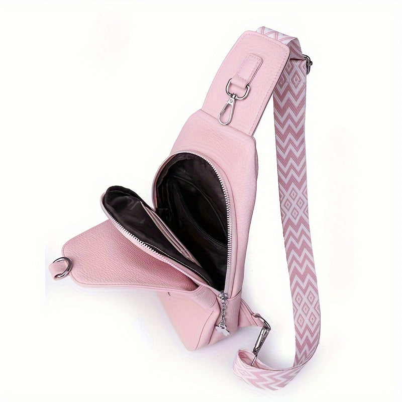 Zaino monospalla rosa in pelle con cerniera aperta, tracolla regolabile a motivo geometrico. Design elegante e pratico per donna.