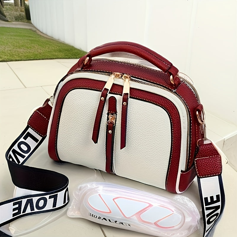 Borsa a tracolla bianca e bordeaux con cerniere dorate, manico superiore, tracolla regolabile con scritta "LOVE". Design elegante e moderno.