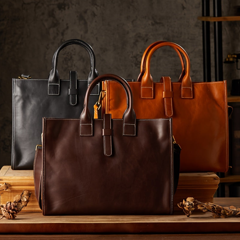 Tre eleganti borse in pelle di alta qualità, colori nero, marrone e cuoio, su sfondo neutro. Design moderno, ideale per lavoro e moda.