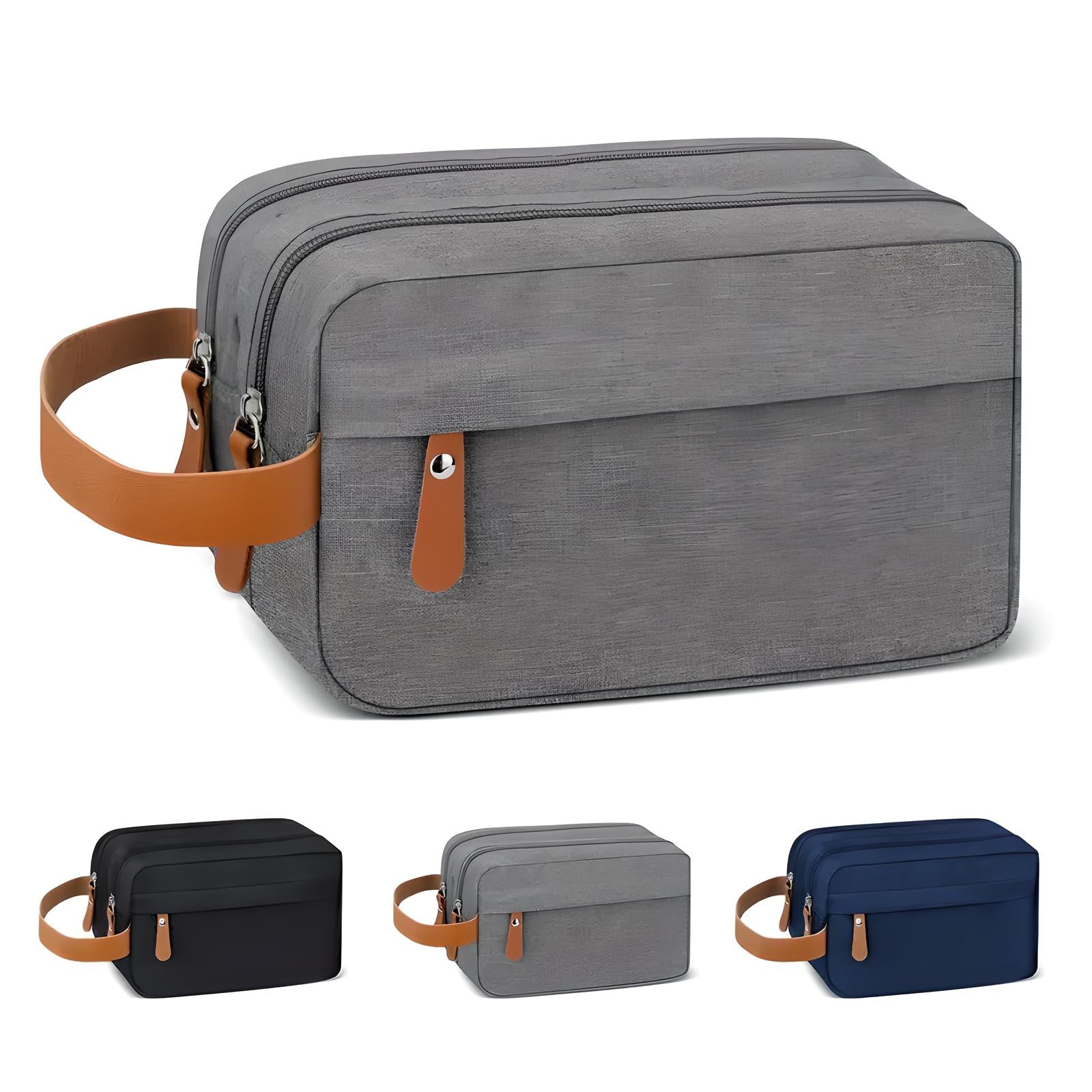 Borsa da toilette grigia con manico in pelle marrone, doppia cerniera, tasca frontale. Disponibile in vari colori: nero, grigio, blu.