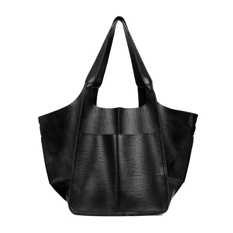 Borsa tote in pelle nera, design elegante e spazioso, ideale per shopping e uso quotidiano. Accessorio moda donna, stile contemporaneo.