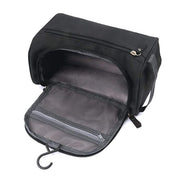 Borsa da toilette nera aperta con gancio, tasche a rete e zip. Ideale per viaggi, organizzazione accessori bagno, resistente e compatta.