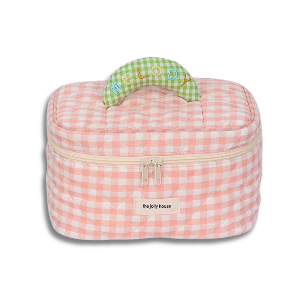 Borsa termica rosa a quadretti, manico verde con scritta "Melody", chiusura a zip, ideale per picnic e viaggi. Accessorio pratico e alla moda.