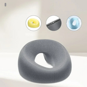 Cuscino ergonomico grigio per seduta, design a ciambella, supporto lombare, ideale per ufficio e casa. Include varianti colore giallo e blu.