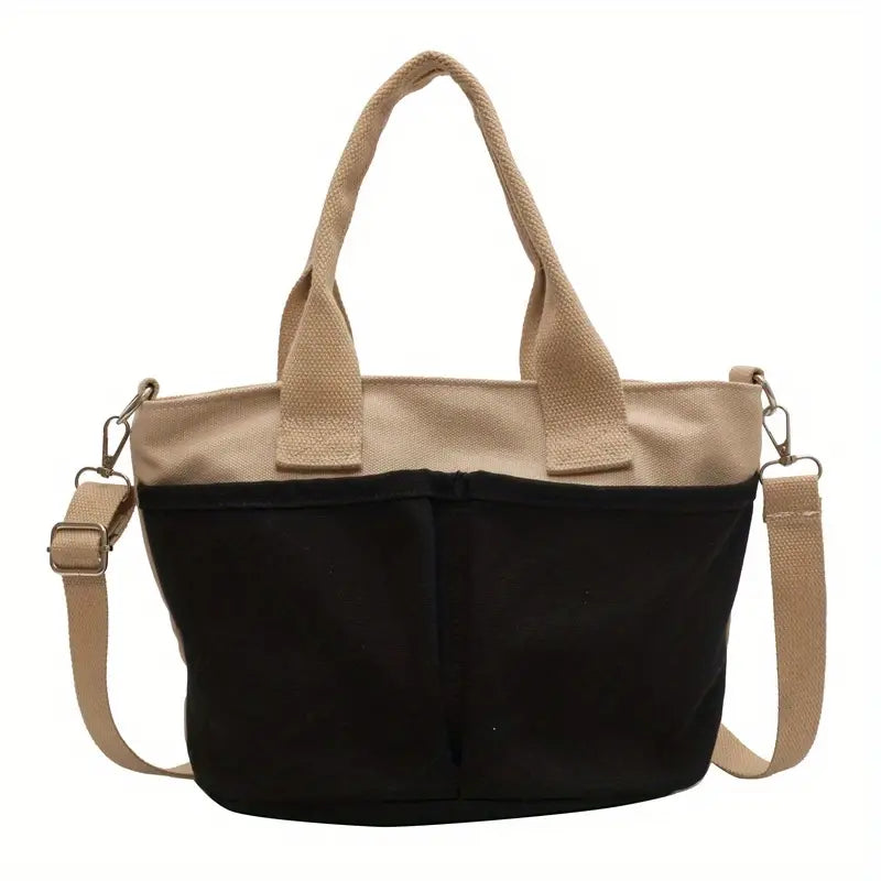 Borsa a tracolla donna in tela nera e beige, design casual, manici robusti, tasche frontali, ideale per shopping e uso quotidiano.