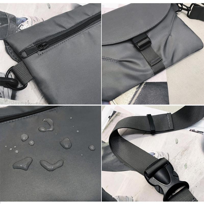 Borsa a tracolla impermeabile grigia, con cerniera, fibbia regolabile e tracolla robusta. Design moderno e resistente all'acqua.