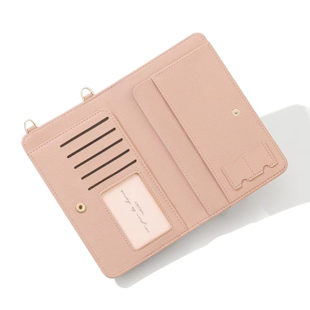 Portafoglio donna in pelle rosa chiaro aperto, con scomparti per carte e tasca trasparente. Elegante accessorio moda, ideale per organizzazione.