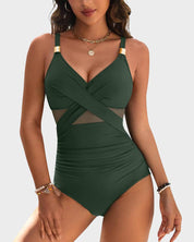 Costume intero verde scuro con dettagli incrociati e inserti in rete, spalline regolabili, accessori dorati, ideale per moda mare donna.