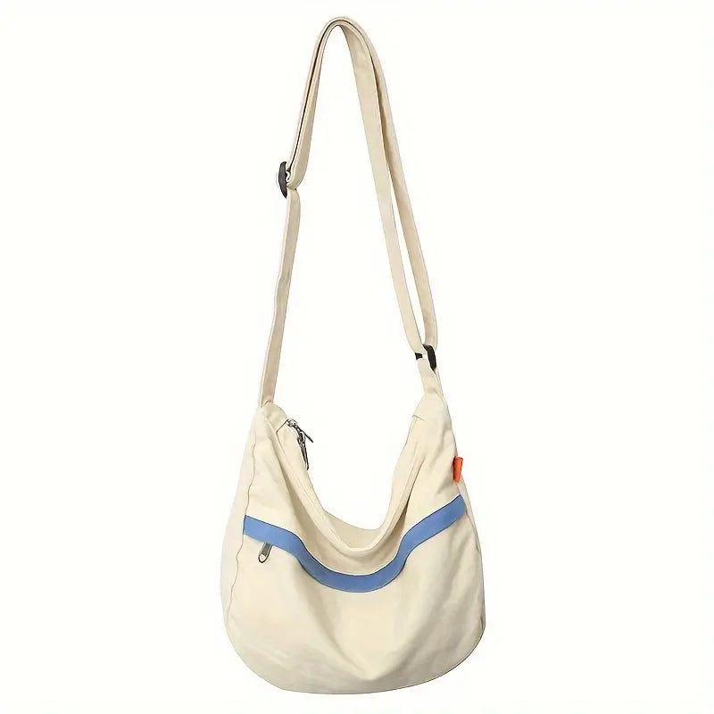Borsa a tracolla beige con dettagli blu, design moderno, chiusura a zip, ideale per uso quotidiano. Accessorio moda donna, stile casual.