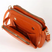Borsa a tracolla in pelle arancione con cerniere dorate, tasche multiple e tracolla regolabile. Design elegante e funzionale per donna.