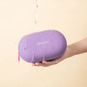 Custodia impermeabile viola Jordan & Judy, design ovale, resistente all'acqua, tenuta in mano, ideale per protezione oggetti personali.