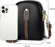 Borsa a tracolla nera in pelle PU con dettagli marroni, dimensioni 18x15x7 cm, accanto a uno smartphone bianco. Accessorio moda elegante e compatto.