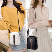 Due borse a tracolla eleganti, una bianca e una nera, con cerniera dorata, indossate da modelle in abiti casual. Accessori moda donna.
