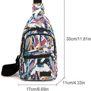 Zaino monospalla multicolore con motivo astratto, dimensioni 30x17x11 cm, ideale per viaggi e uso quotidiano. Tasche multiple con cerniera.