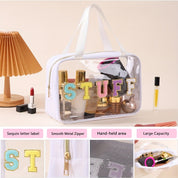 Borsa trasparente da viaggio con scritta "STUFF", cerniera in metallo, ampia capacità, manico resistente, ideale per cosmetici e accessori.