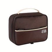 Borsa termica marrone con manico beige, tasca frontale con zip, ideale per pranzo al sacco, picnic, viaggi. Design compatto e funzionale.