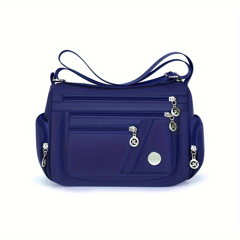 Borsa a tracolla blu in nylon con tasche multiple e cerniere, design elegante e funzionale, ideale per donna, accessorio moda versatile.