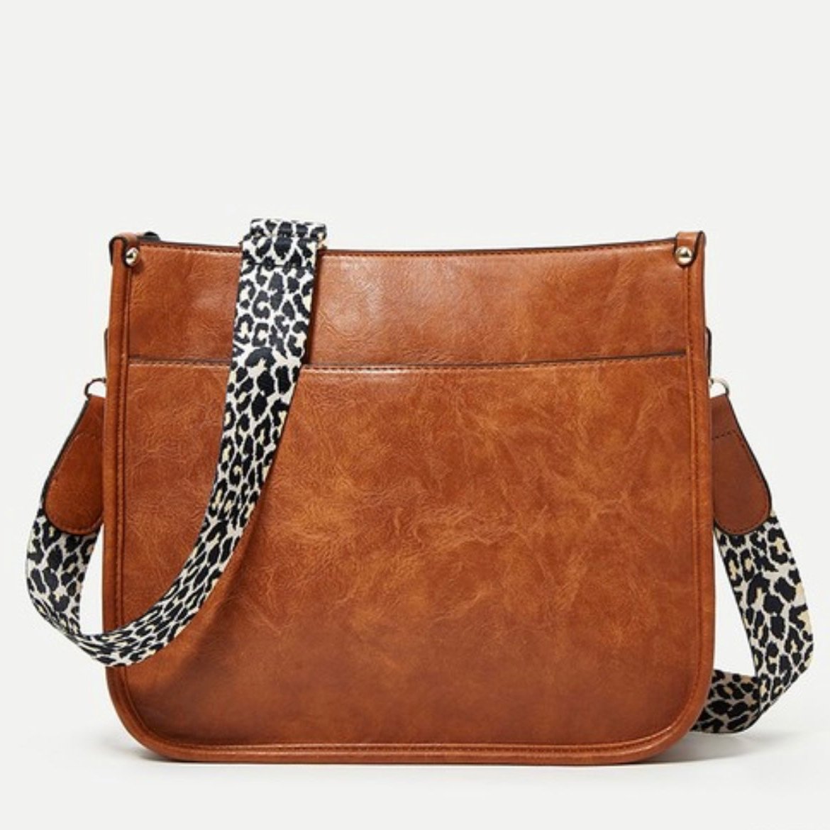 Borsa a tracolla in pelle marrone con cinturino leopardato, design elegante e moderno, perfetta per moda donna e accessori casual chic.
