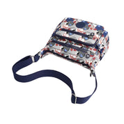 Zaino a tracolla multicolore con motivo astratto, tasche multiple e cinghia regolabile blu. Design moderno e funzionale per uso quotidiano.