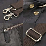 Cinghia borsa in pelle nera con dettagli metallici: moschettoni, fibbia regolabile, cerniera robusta. Accessori moda, alta qualità.