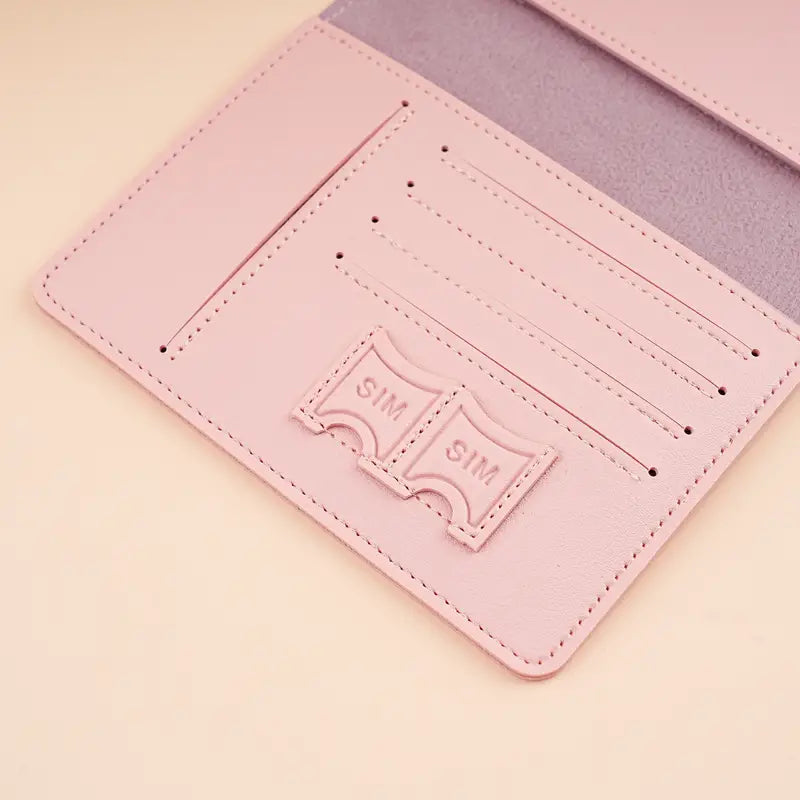 Portafoglio rosa in pelle con slot per carte di credito e SIM, design elegante e compatto, accessorio moda donna, organizzazione pratica.