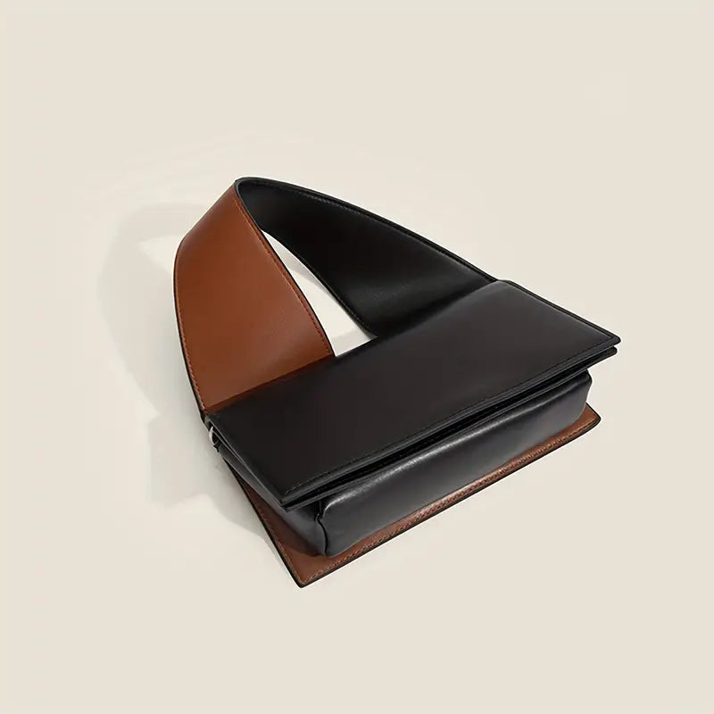 Borsa a tracolla in pelle bicolore marrone e nera, design moderno e minimalista, accessorio moda elegante per donna, perfetta per ogni occasione.