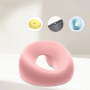 Cuscino ergonomico rosa per seduta, supporto lombare, design a ciambella, ideale per ufficio e casa. Materiale morbido e traspirante.