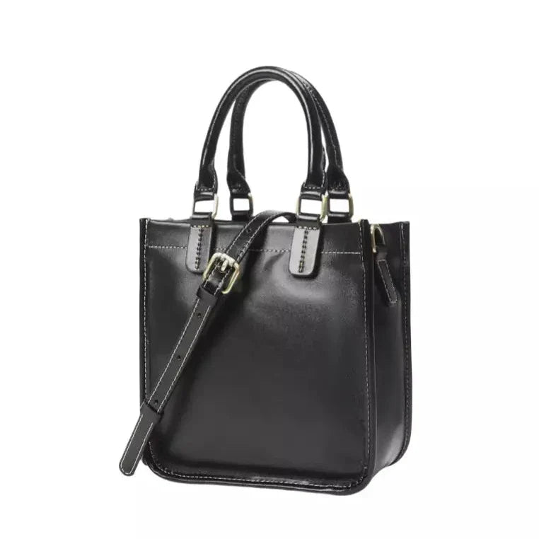 Borsa a mano in pelle nera lucida con manici e tracolla regolabile, design elegante e moderno, ideale per moda donna e accessori di lusso.