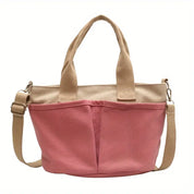 Borsa a tracolla in tela rosa con manici beige, design casual e pratico, ideale per shopping e uso quotidiano. Accessorio moda donna.
