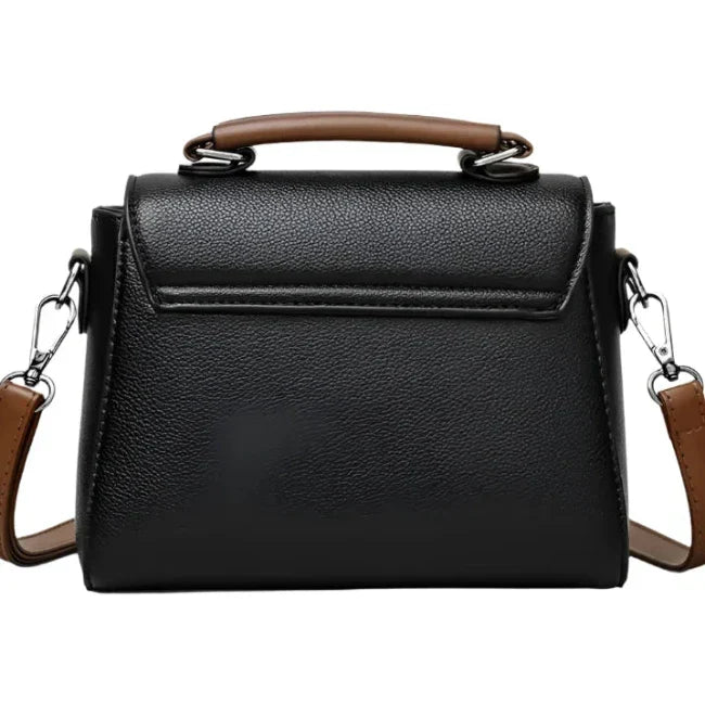 Borsa a tracolla in pelle nera con manico marrone, design elegante e moderno, ideale per donna, accessorio moda versatile e chic.