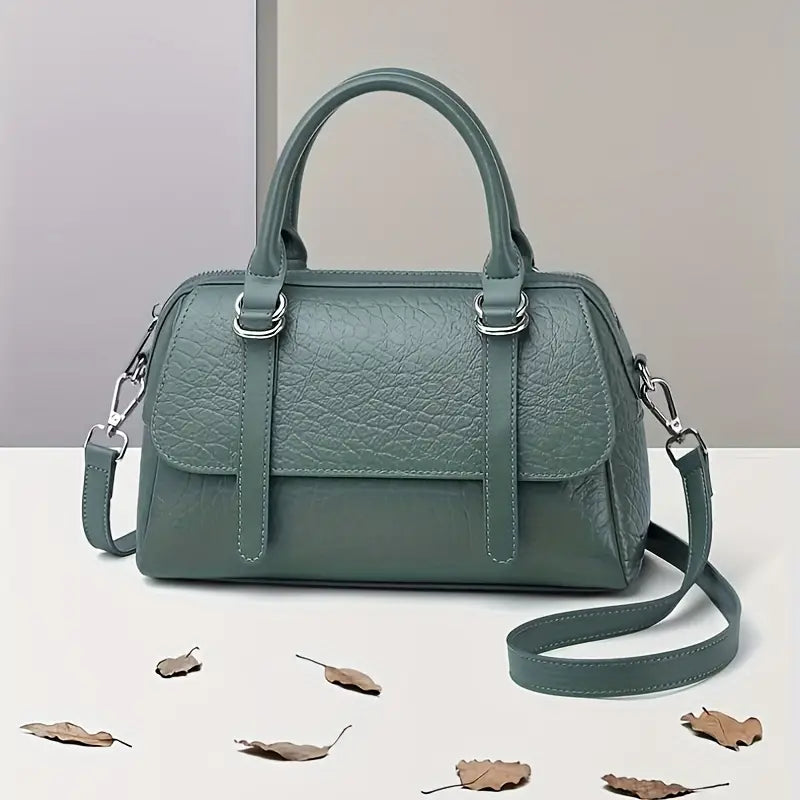 Borsa a mano in pelle verde, design elegante con tracolla removibile, ideale per moda donna. Accessorio chic per ogni occasione.