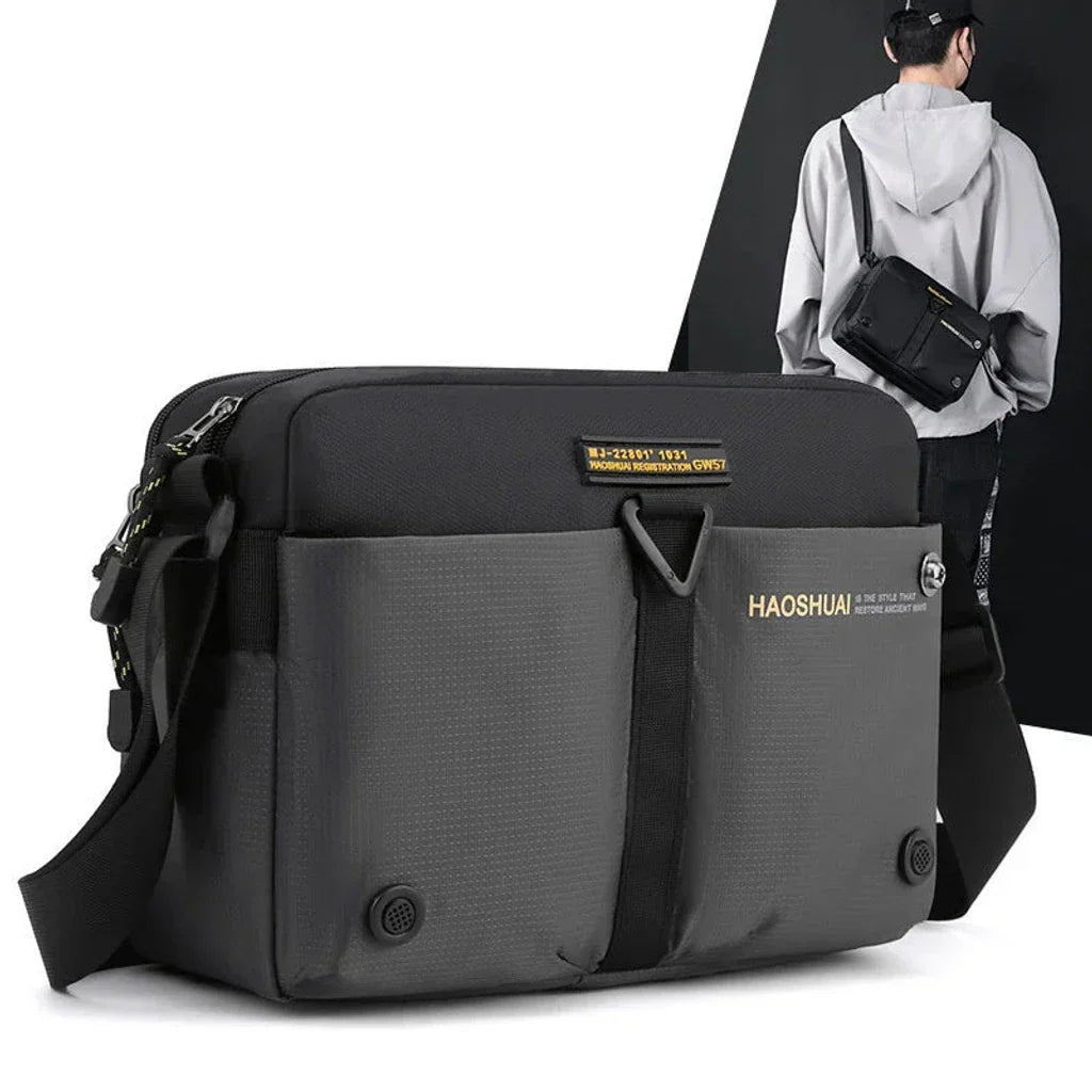 Borsa a tracolla nera HAOSHUAI, design moderno, tasche multiple, ideale per uomo, resistente all'acqua, perfetta per viaggi e uso quotidiano.