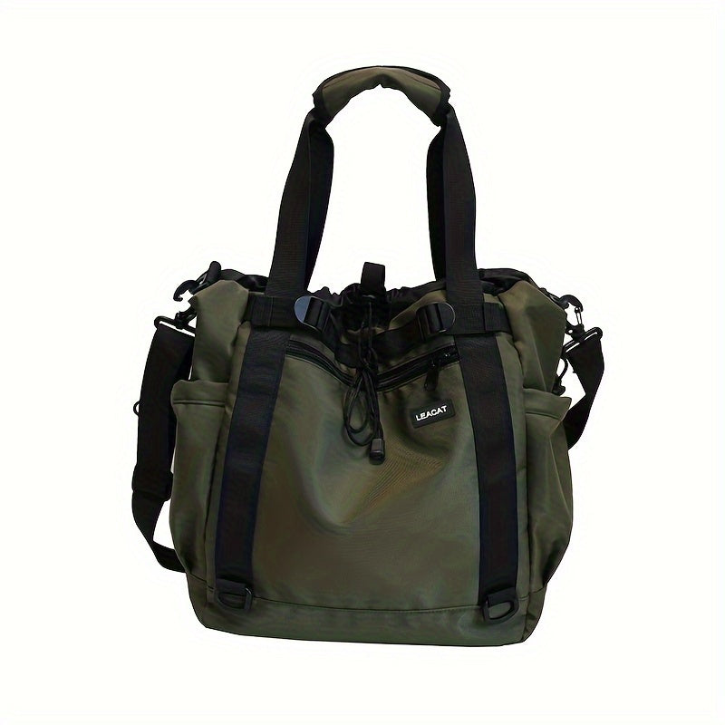 Borsa a tracolla verde oliva con manici neri, tasche laterali e chiusura a coulisse. Design moderno, ideale per viaggi e uso quotidiano.