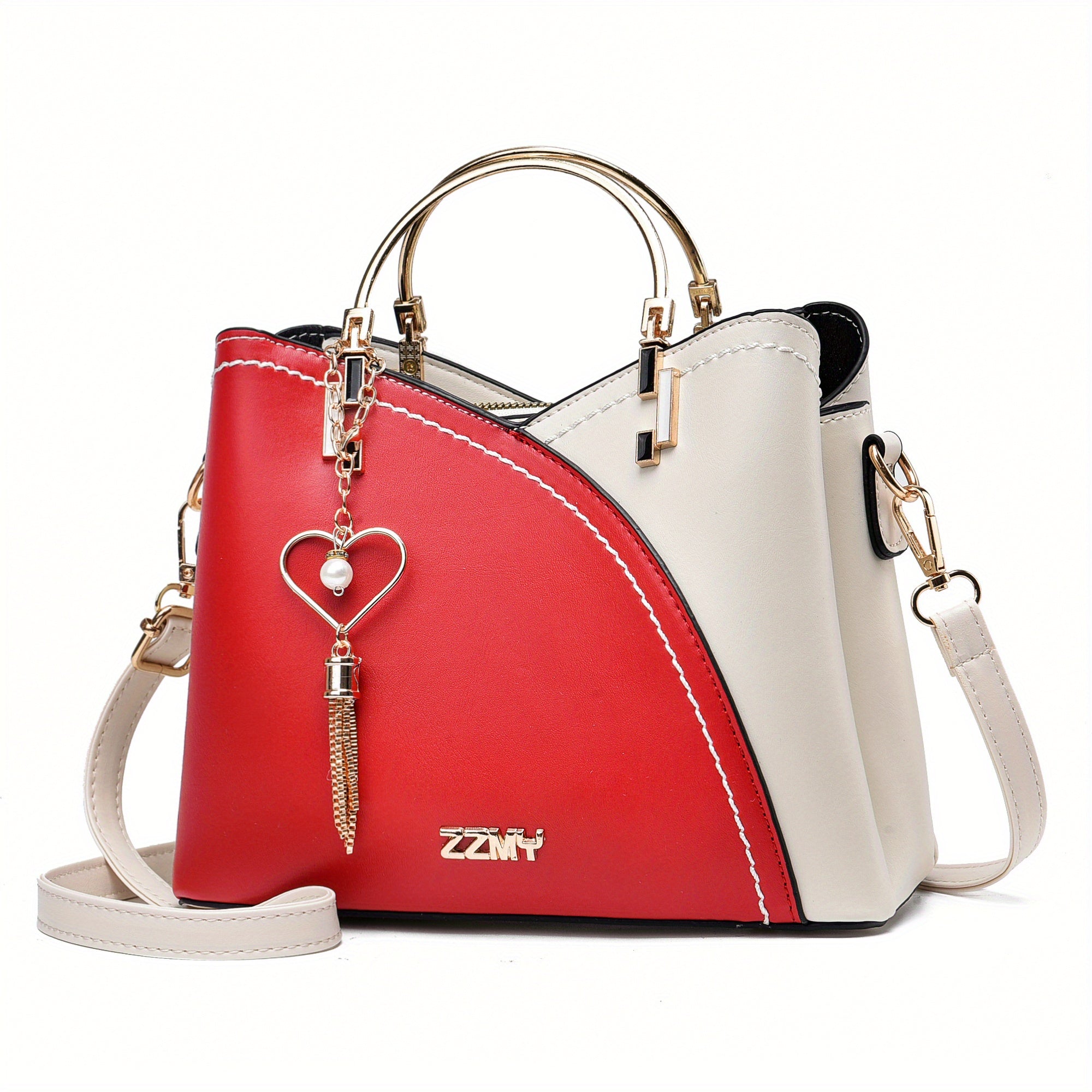 Borsa a tracolla donna in pelle bicolore rosso e bianco, con manici dorati e ciondolo a cuore. Elegante e moderna, perfetta per ogni occasione.