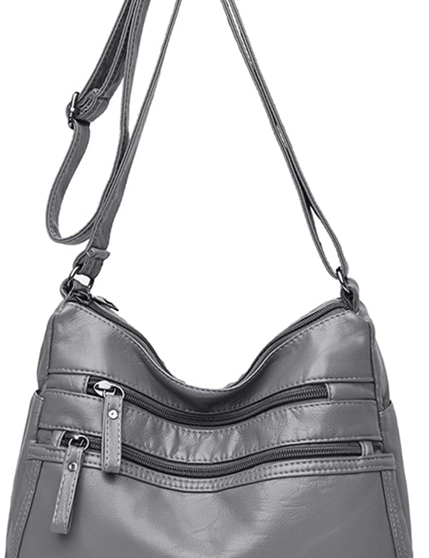 Borsa a tracolla in pelle grigia con cerniere multiple, design elegante e pratico, ideale per donna. Accessorio moda versatile e spazioso.