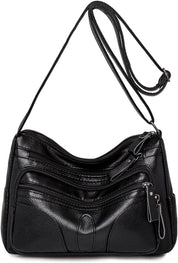 Borsa a tracolla in pelle nera con cerniere multiple, design elegante e pratico, ideale per donna. Accessorio moda versatile e resistente.