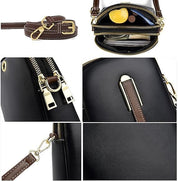 Borsa a tracolla in pelle nera con dettagli marroni, cerniere dorate, tasche multiple e tracolla regolabile. Elegante e funzionale per ogni occasione.