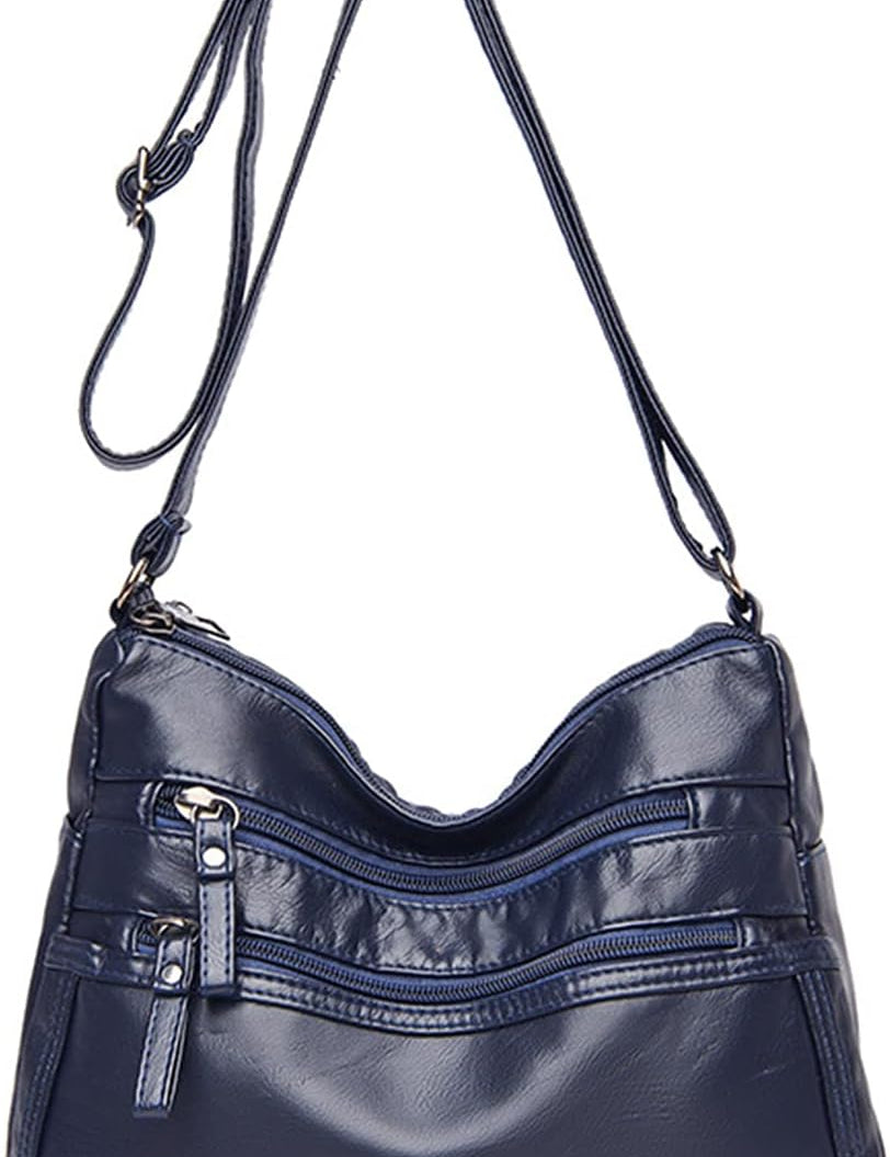 Borsa a tracolla in pelle blu scuro con cerniere multiple, design elegante e pratico, ideale per donna. Accessorio moda versatile e chic.