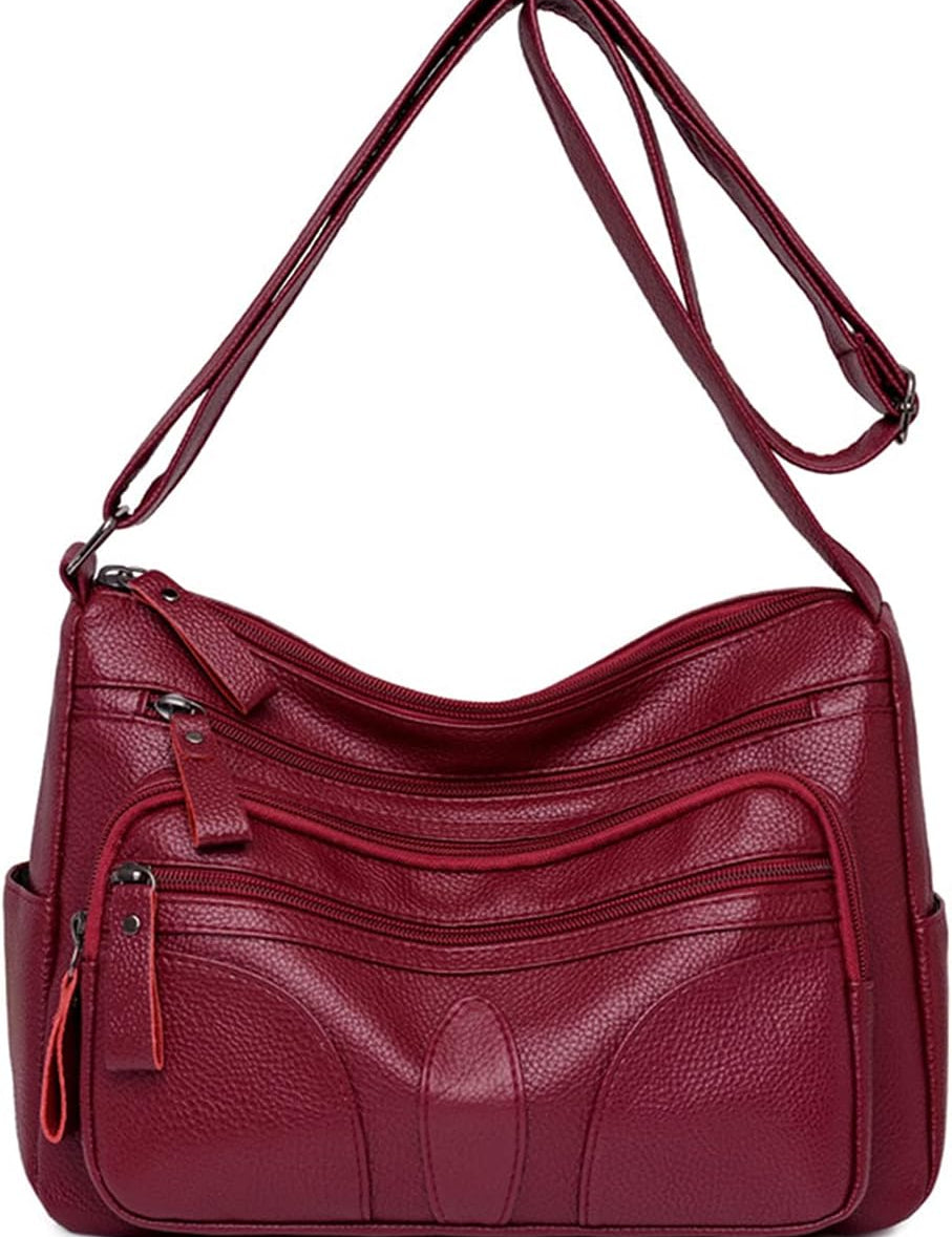 Borsa a tracolla in pelle rossa con tasche multiple e cerniere, design elegante e pratico, ideale per donna. Accessorio moda versatile e capiente.