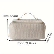 Borsa da toilette beige in tessuto, dimensioni 25x12x11 cm, con manico e cerniera dorata. Ideale per viaggi, organizer cosmetici.