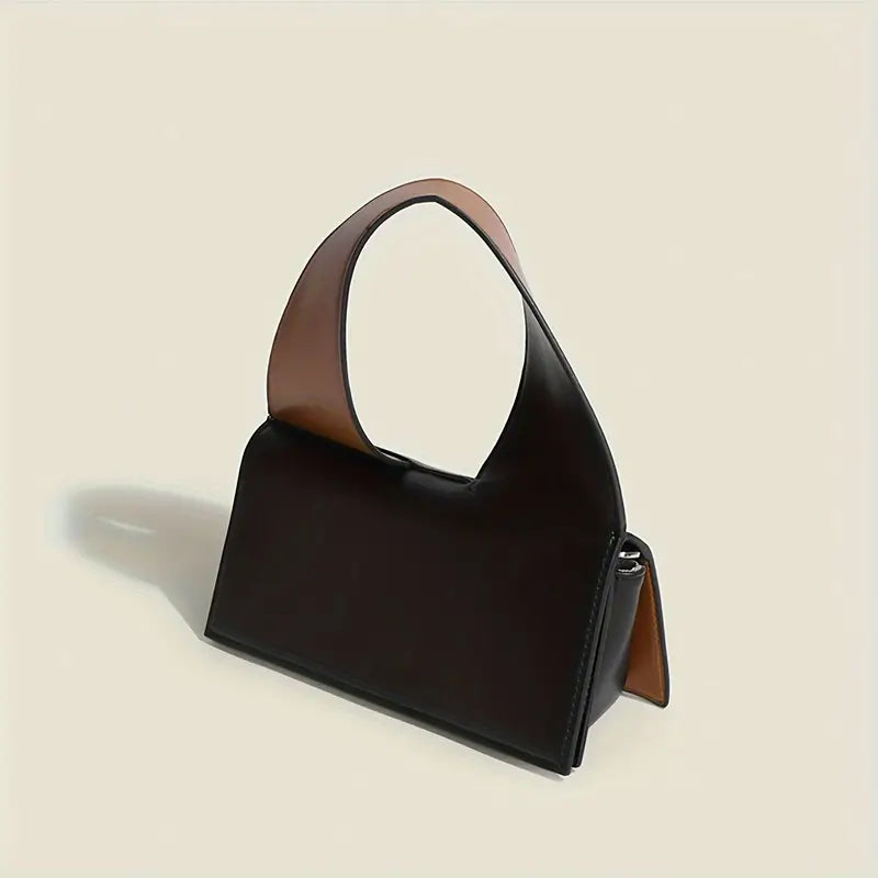 Borsa a mano in pelle nera con manico ampio marrone, design moderno ed elegante. Accessorio moda donna, ideale per look sofisticati.