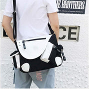 Borsa a tracolla unisex bianca e nera, design moderno, tasche multiple, chiusura con zip, ideale per scuola o lavoro, stile casual urbano.