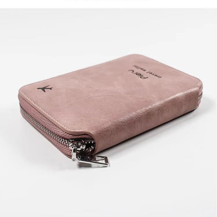 Portafoglio donna in pelle rosa con cerniera, design elegante e compatto, ideale per carte e contanti. Accessorio moda femminile di tendenza.